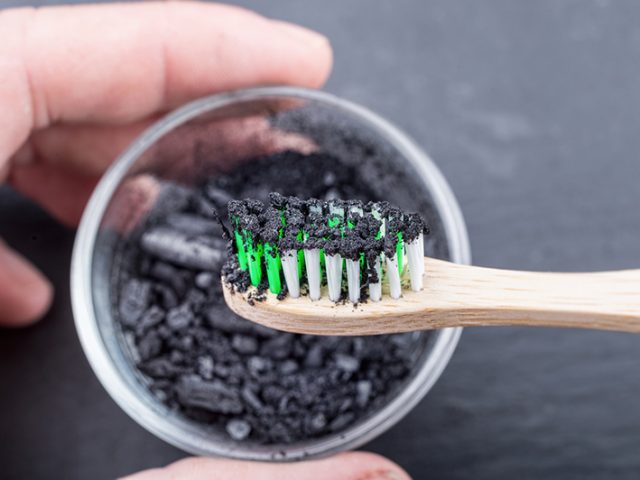 The Truth About Charcoal Teeth Whitening & Oral Health (featured image)