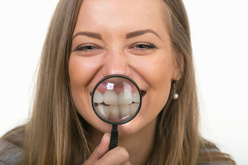 Woman magnifying her teeth
